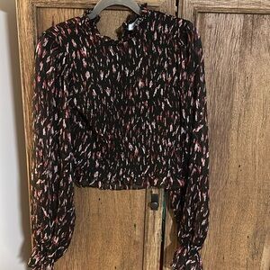 Boutique top with sheer sleeves sz med